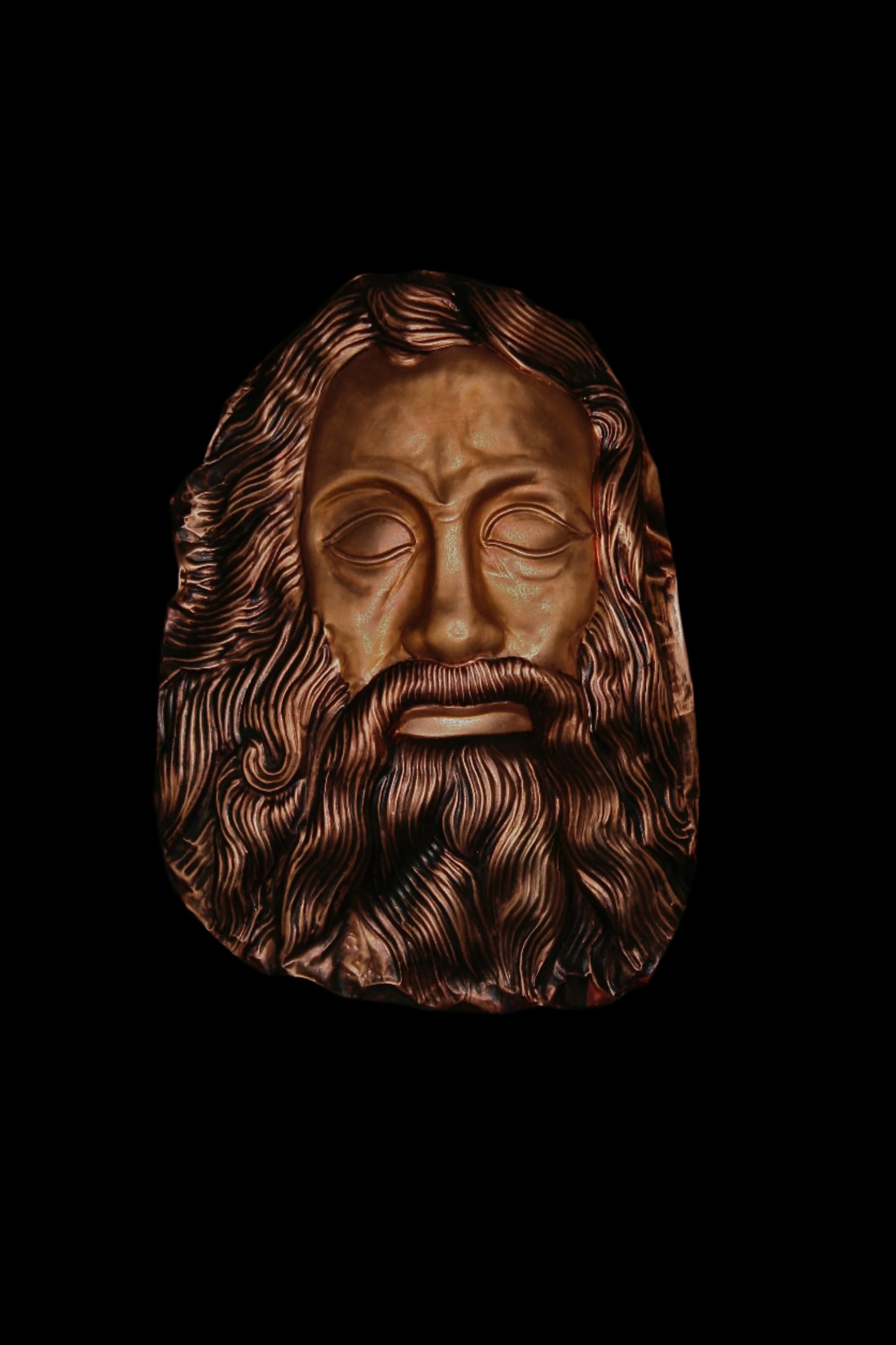 Mask of Odyssey repousse on copper relief wall sculpture.