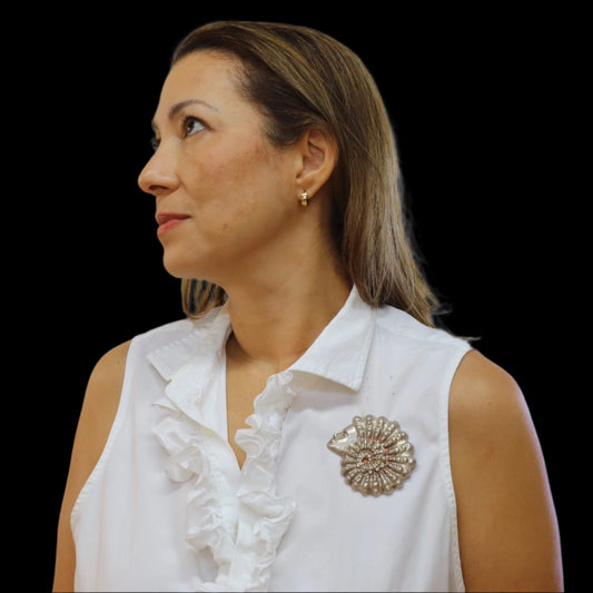 Brooch repousse on silver